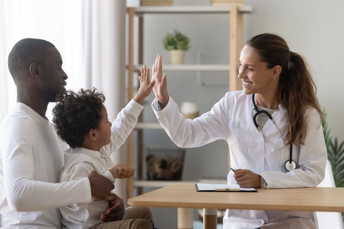 doctor high fiving a child